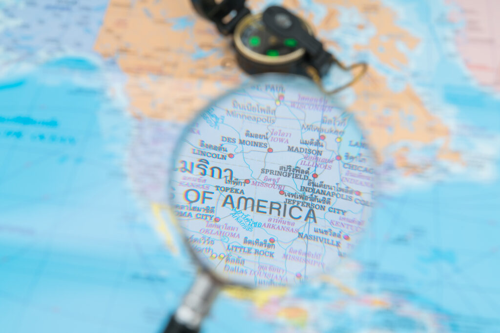 Travel preparation : compass,sunglasses,magnifying glass on road map